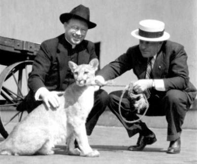 Lorenzo M. Malone, S. J. with Betty the Mountain Lion, and C. T. Truchsel, 1935