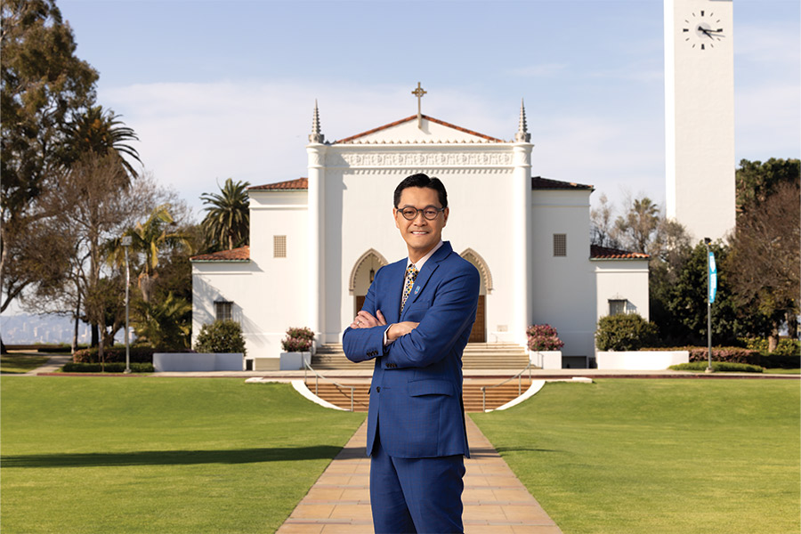 President Tom Poon, Ph.D. in front of LMU's Sacred Heart Chapel